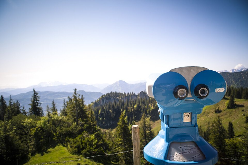 Viewing scope against blue sky and mountains: original