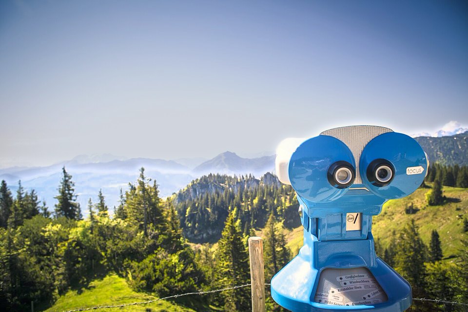 Viewing scope against blue sky and mountains: preset
